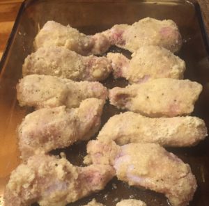 chicken drumettes breaded, in bakind pan and ready to go into the oven